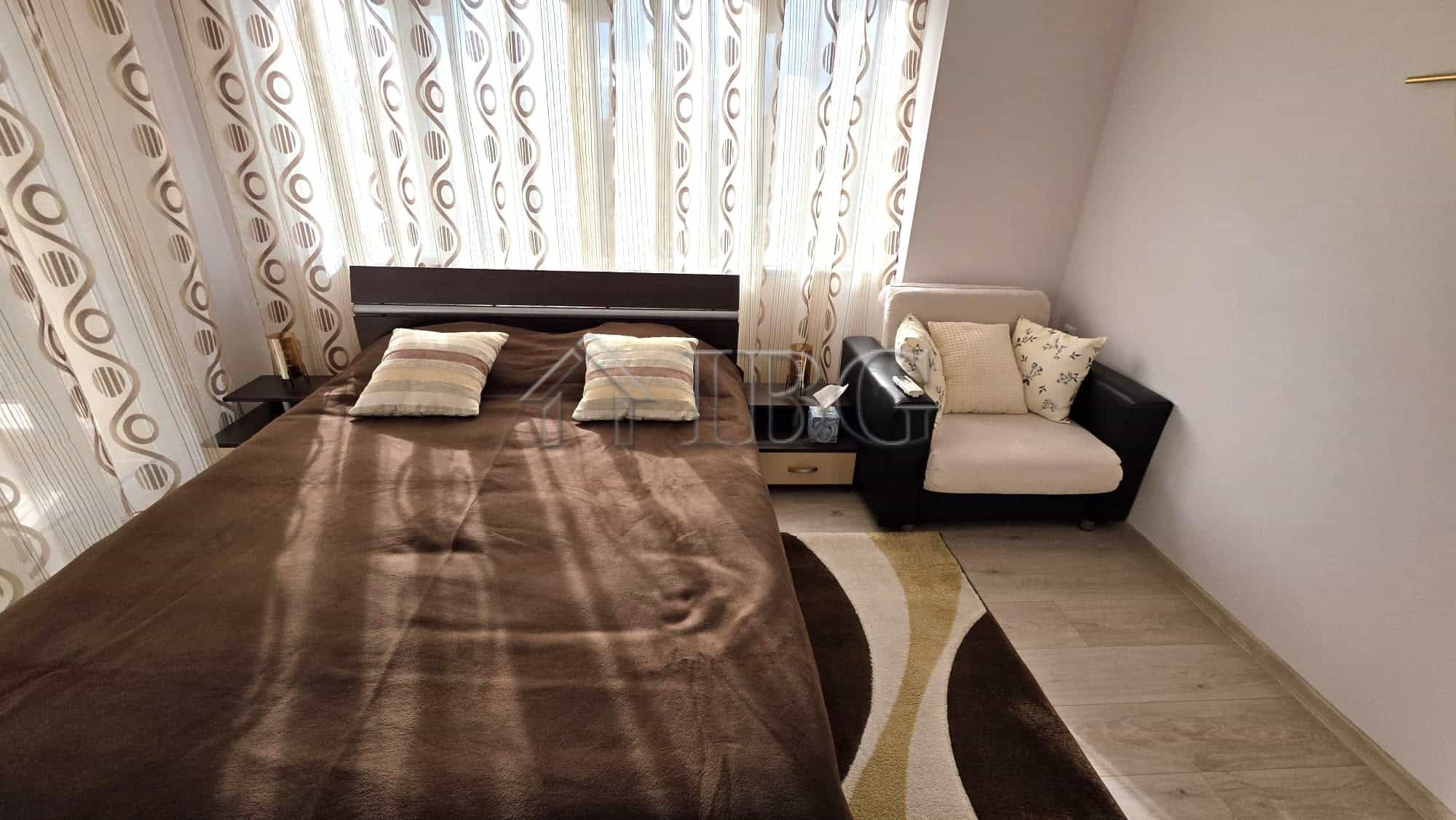 Elegant bedroom in a luxury villa at Victoria Hill, Pomorie. Modern decor with comfortable bedding a.