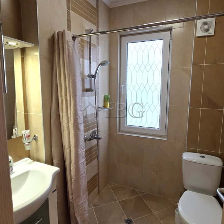 Modern bathroom with shower and window in Victoria Hill villa.