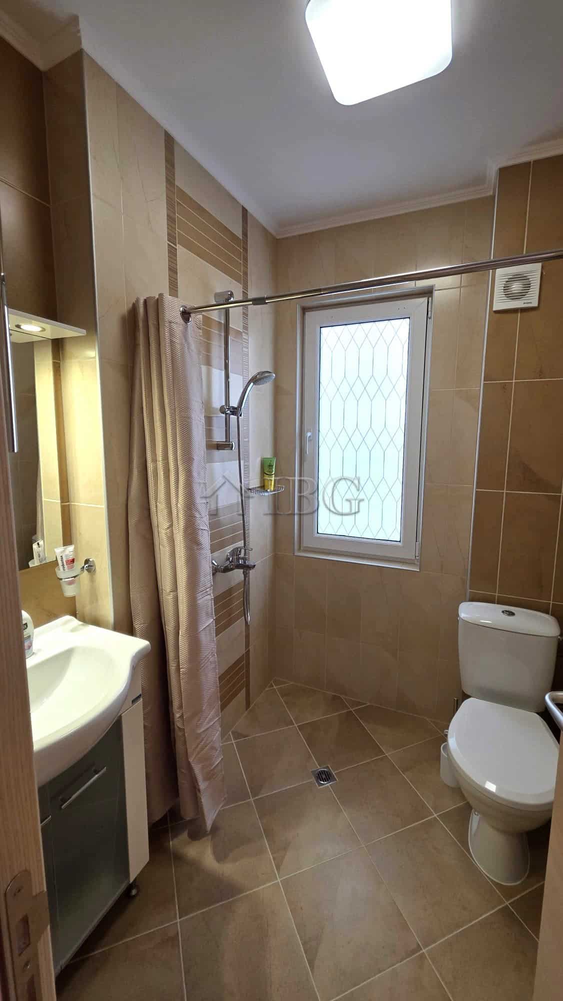 Modern bathroom with shower and window in Victoria Hill villa.
