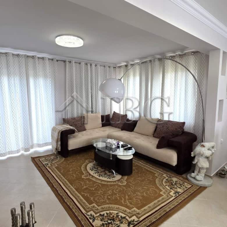 Elegant living room with modern decor and spacious seating area.