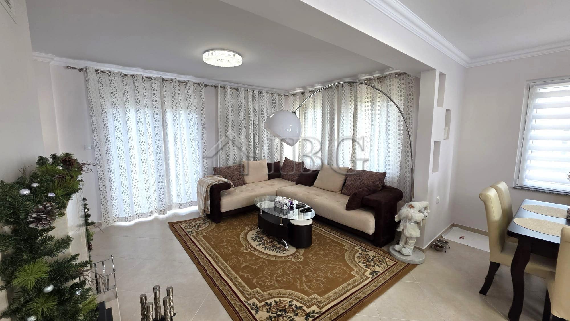 Elegant living room with modern decor and spacious seating area.