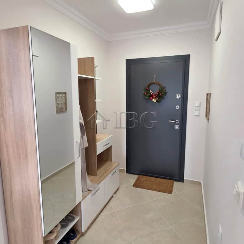 Elegant entrance hall with modern decor and a stylish door.