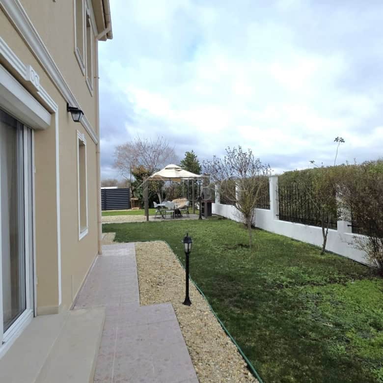 Beautiful villa exterior with a garden and pathway in Pomorie.