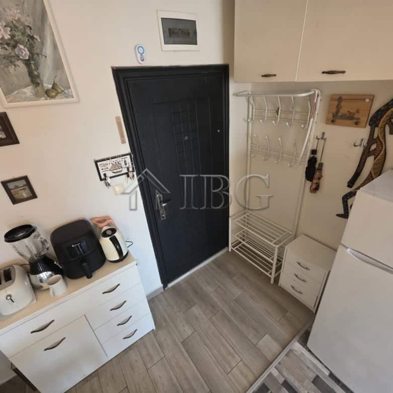 Bright studio apartment with balcony for sale in Sveti Vlas. Modern interior, compact kitchen, and i.
