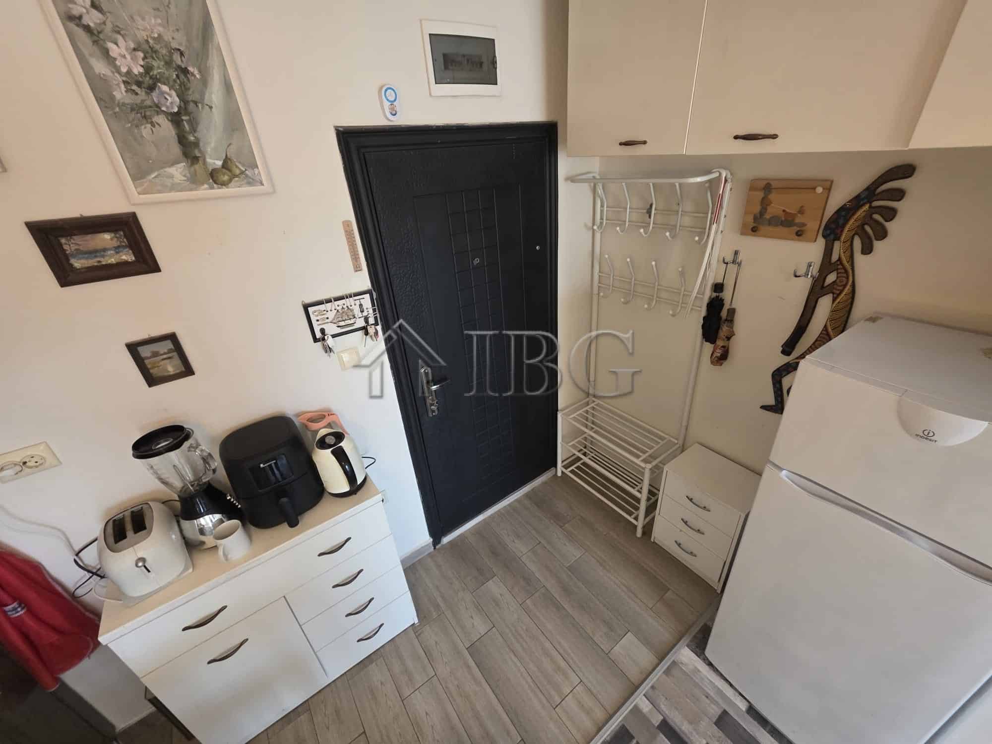 Bright studio apartment with balcony for sale in Sveti Vlas. Modern interior, compact kitchen, and i.