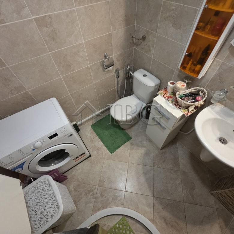 Bright bathroom with washing machine and toiletries in Villa Yurta, Sveti Vlas.