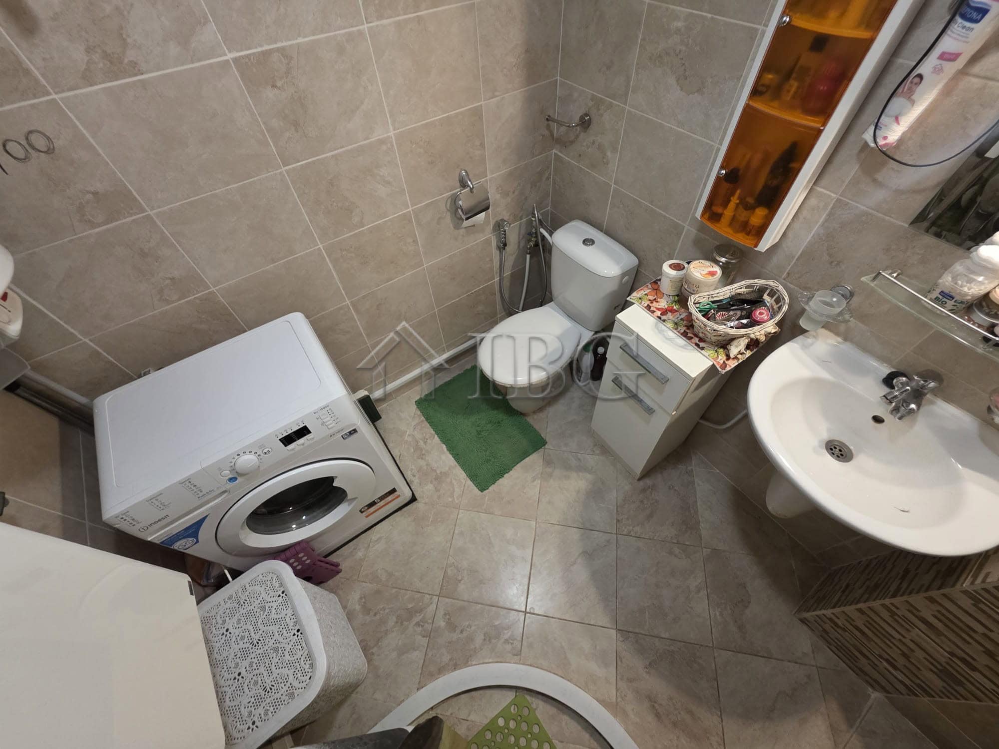 Bright bathroom with washing machine and toiletries in Villa Yurta, Sveti Vlas.