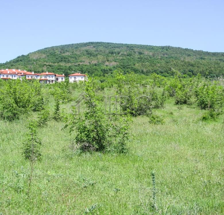 Land plot for sale near Sunny Beach, Bulgaria, with scenic mountain views and lush greenery.