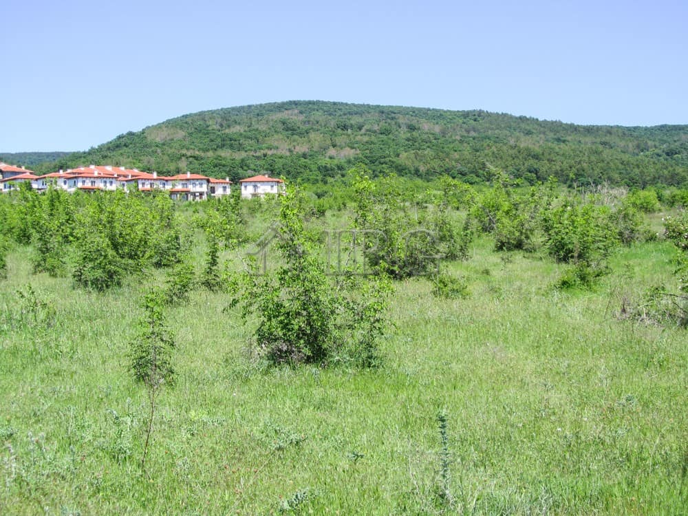 Land plot for sale near Sunny Beach, Bulgaria, with scenic mountain views and lush greenery.