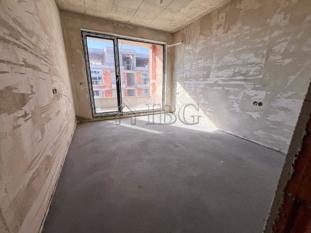 Bright interior with large window in new residential building.