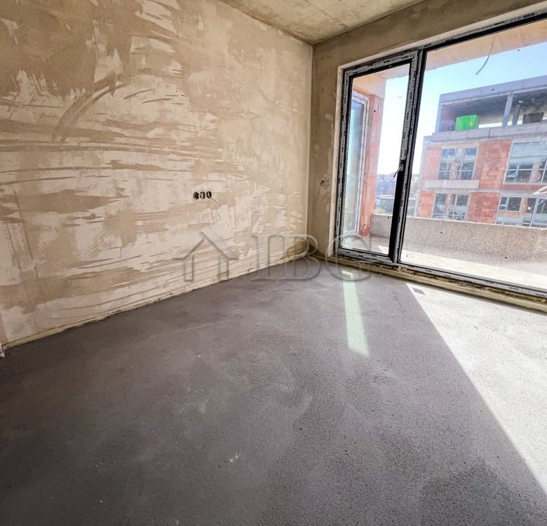 Bright empty room with large windows in a new residential building in Pomorie.