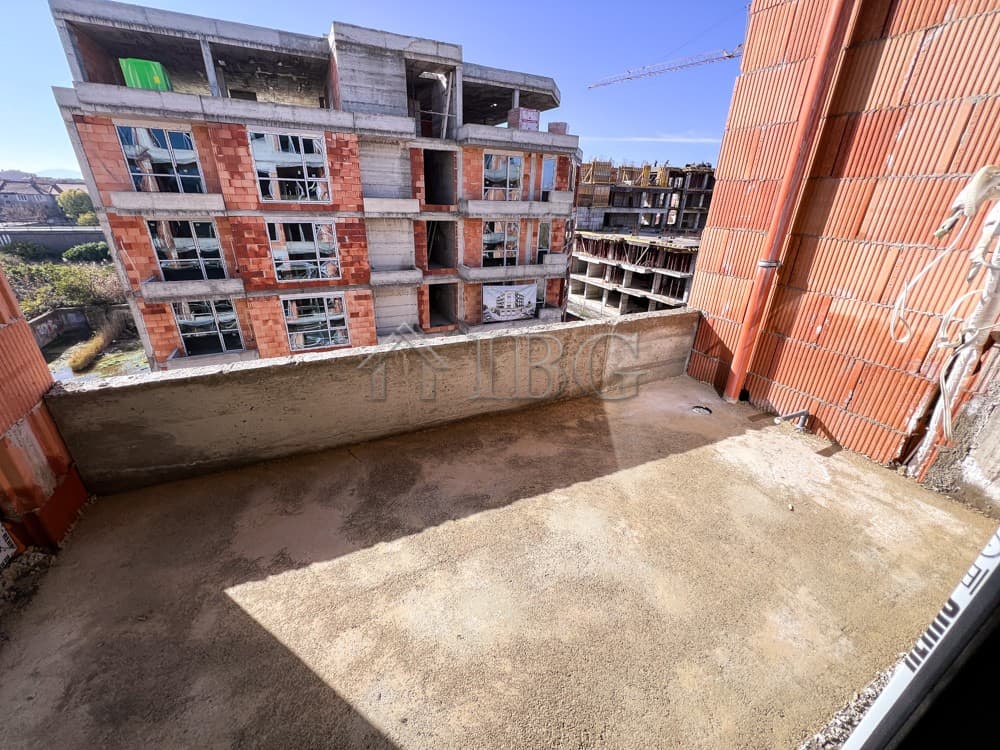 Bright outdoor balcony of a 1-bedroom apartment in Pomorie under construction.