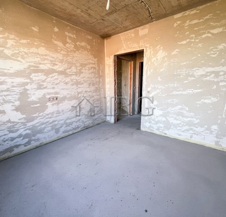 Unfinished 1-bedroom apartment with exposed walls and concrete floor in Pomorie.