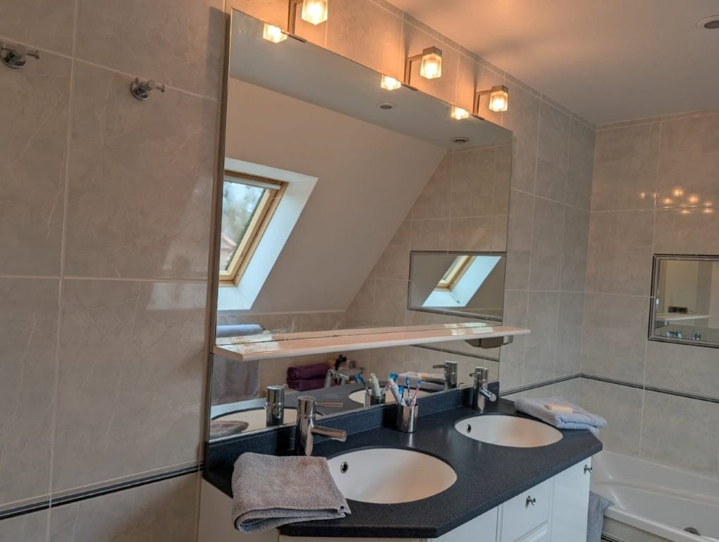 Luxury 4 Bed Le Manoir House in Dordogne Valley Elegant bathroom with dual sinks and skylight in Dordogne Valley property.