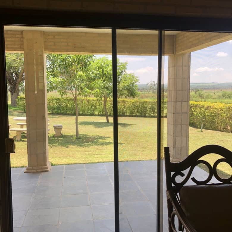 Outdoor patio with scenic garden and golf course views in Paraguay.