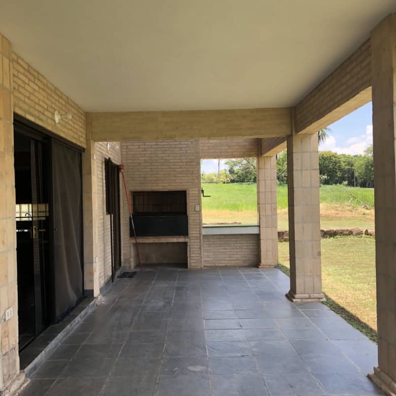 Outdoor patio with built-in barbecue at Carlos Franco Golf and Country Club, Arroyos Y Esteros Parag.