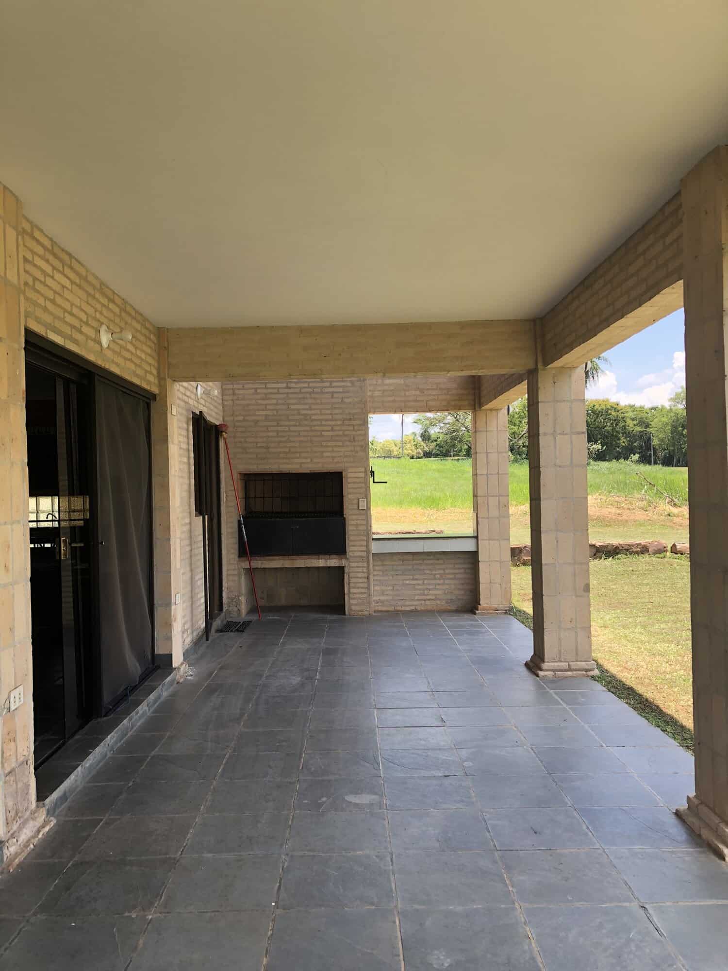 Elegant outdoor patio with barbecue area in Paraguay Outdoor patio with built-in barbecue at Carlos Franco Golf and Country Club, Arroyos Y Esteros Parag.