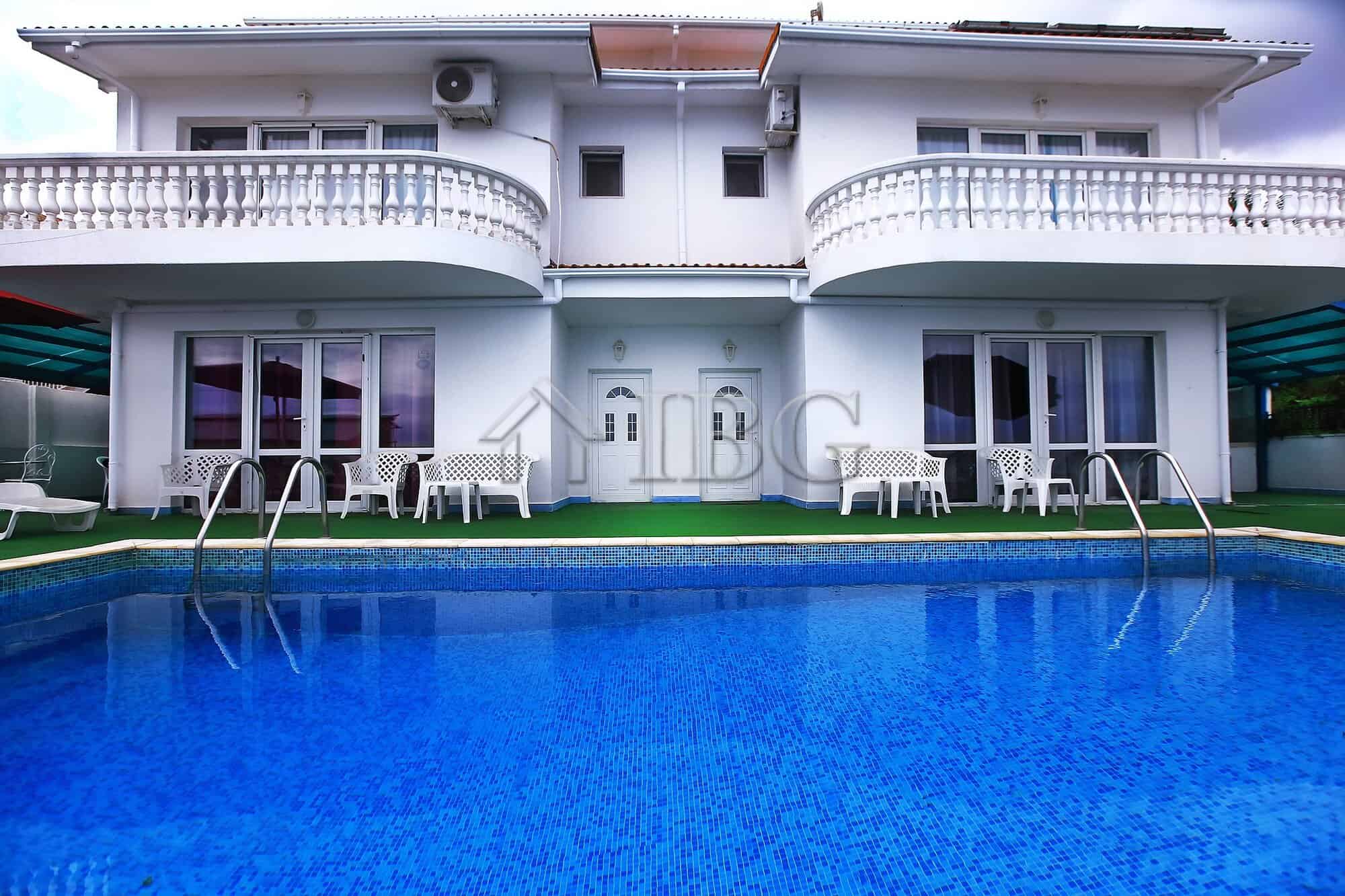 Luxury sea view villa with private pool and spacious outdoor seating in Sorrento, Italy.
