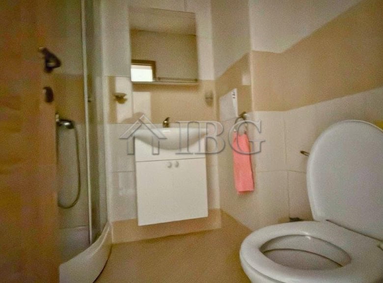 Bathroom with shower, toilet, and sink in Orchid Fort Club, Sunny Beach.