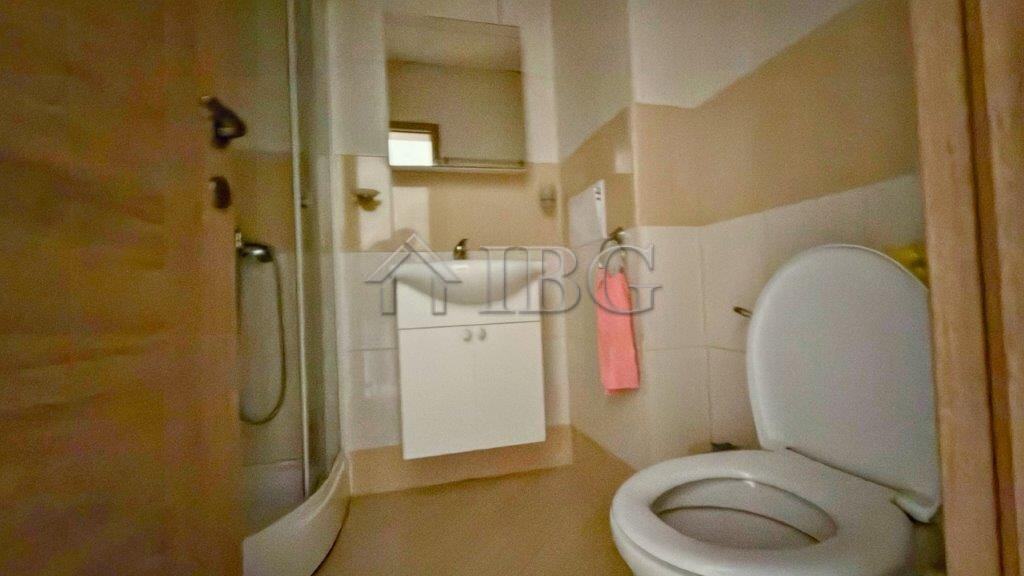 Bathroom with shower, toilet, and sink in Orchid Fort Club, Sunny Beach.