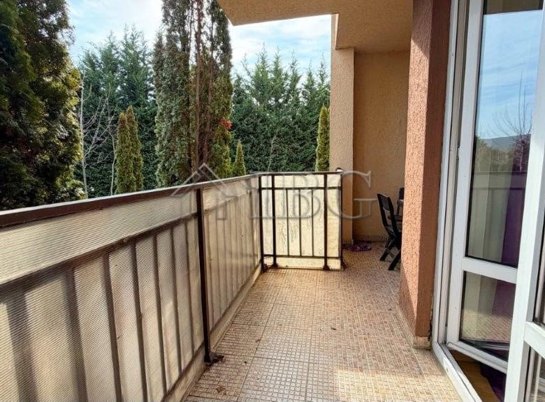 Cozy studio balcony overlooking a swimming pool at Orchid Fort Club, Sunny Beach.