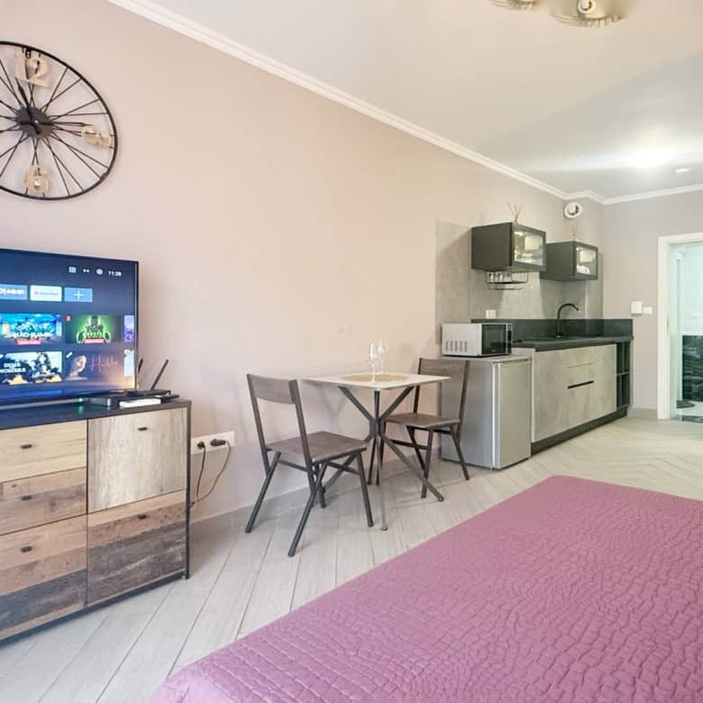 Bright studio apartment in Valencia Gardens, Nessebar, with modern furnishings and open-plan living.