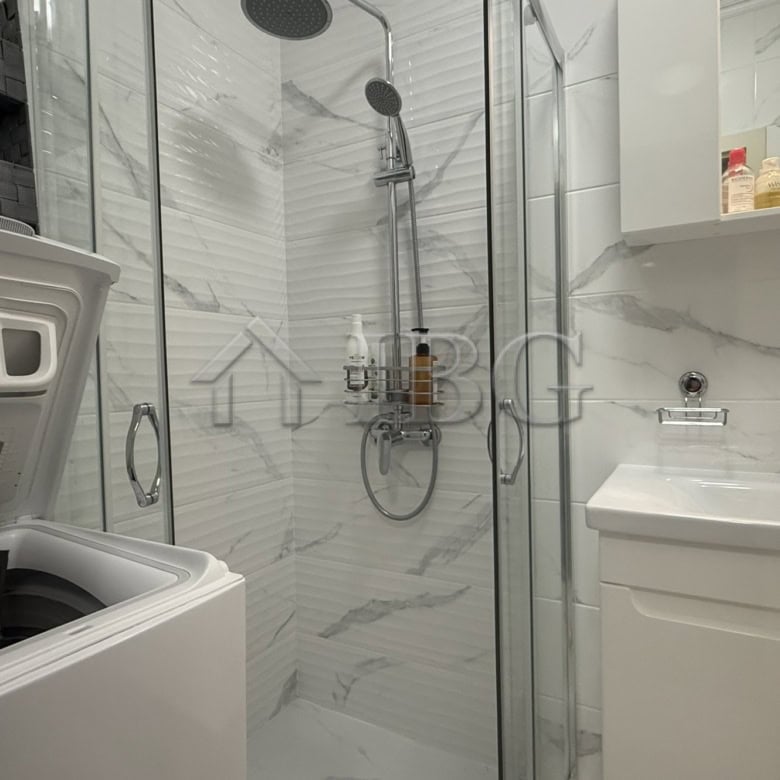 Bathroom of a studio apartment in Valencia Gardens, Nessebar, featuring modern fixtures and marble-s.