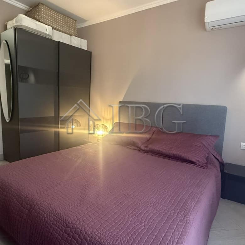 Bedroom with purple bedding and contemporary decor in Valencia Gardens, Nessebar.