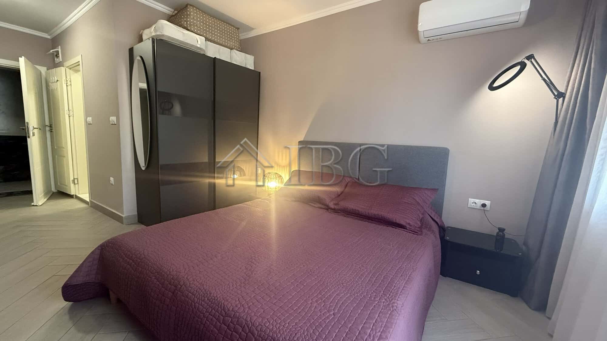 Bedroom with purple bedding and contemporary decor in Valencia Gardens, Nessebar.