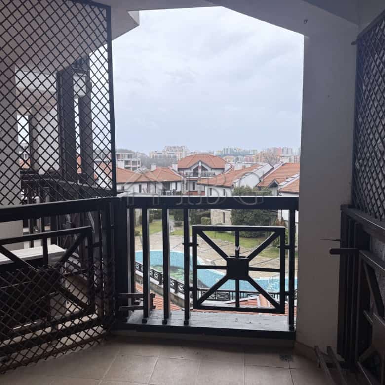 Balcony view of the pool and surrounding area from a studio in Chairite Complex, Kosharitsa.
