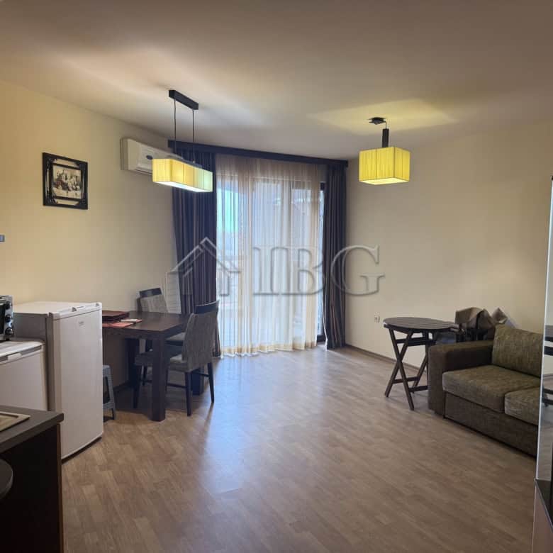 Bright studio apartment in Chairite Complex, Kosharitsa, with modern furnishings and large windows.