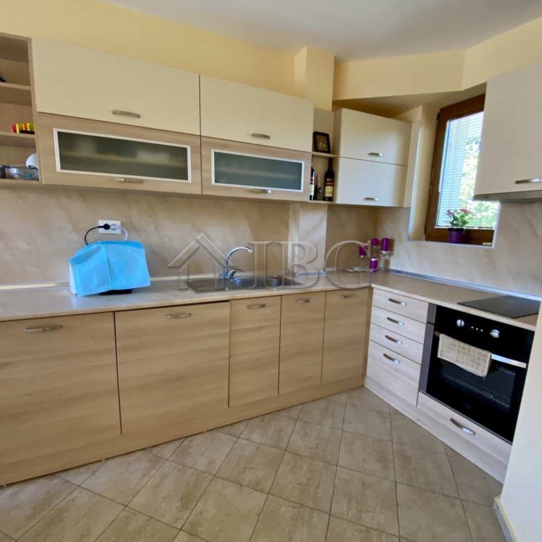 Bright and spacious one-bedroom apartment kitchen with pool view in Chateau Del Mar, Sunny Beach.