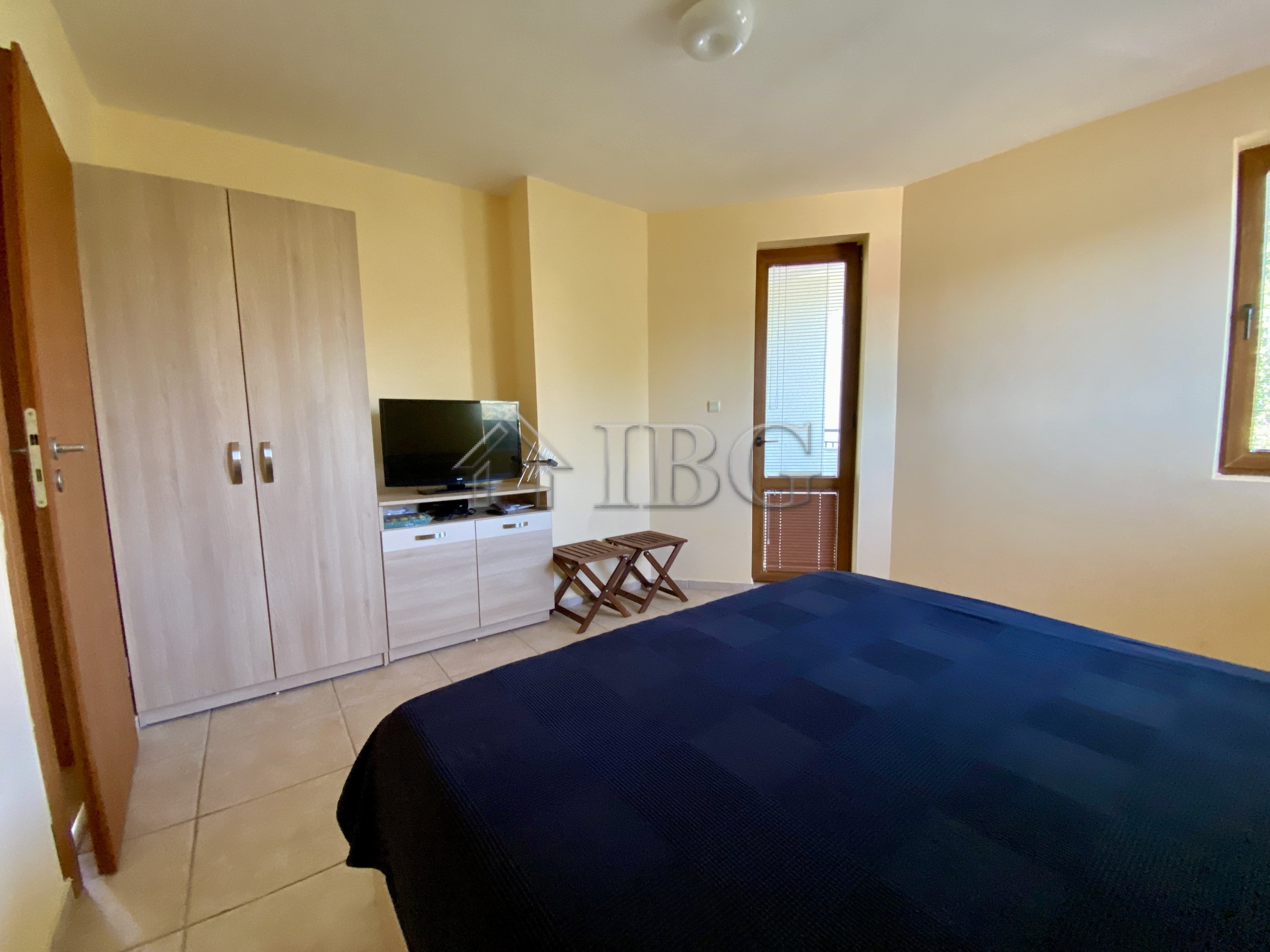 Spacious bedroom in Chateau Del Mar with pool view in Sunny Beach.