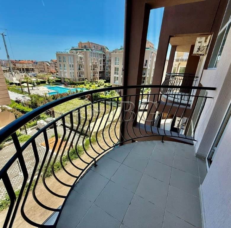 Balcony of a studio apartment in Ravda near LIDL and the beach, offering a relaxing outdoor space.