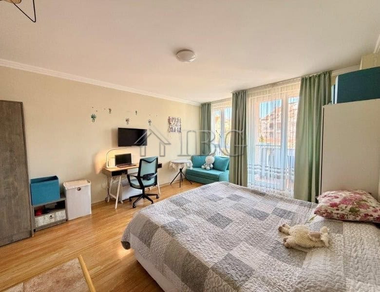 Cozy studio apartment with balcony, modern furnishings, and sea views near Nessebar beach.