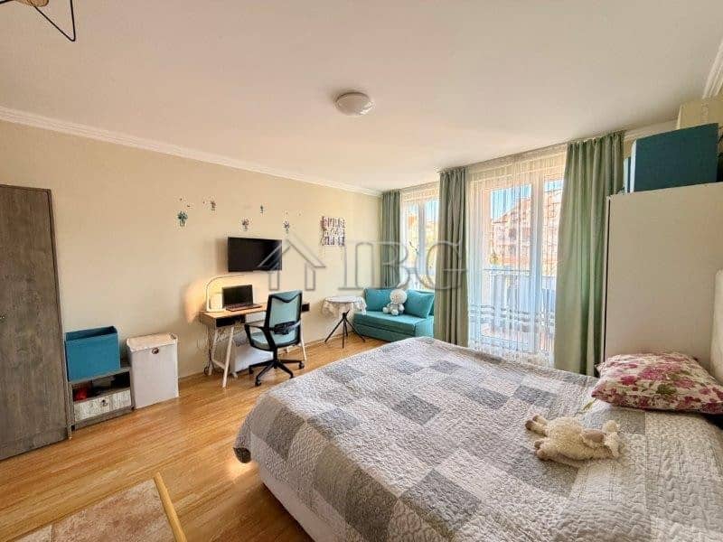 Cozy studio apartment with balcony, modern furnishings, and sea views near Nessebar beach.