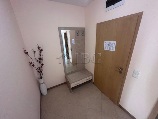 Furnished one-bedroom apartment in Royal Sun, Sunny Beach, with modern decor and compact entryway.