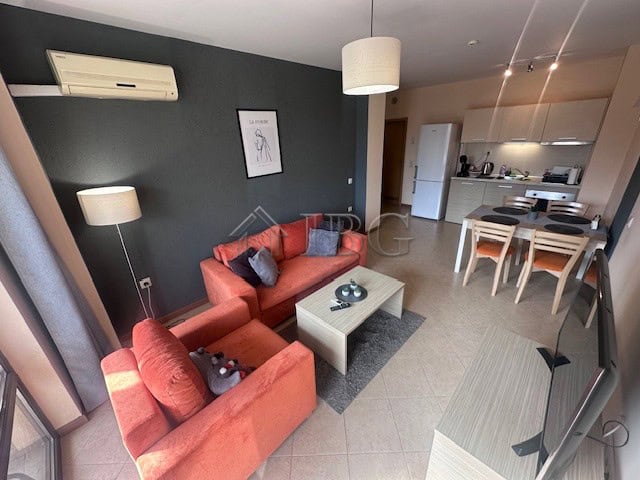 Modern furnished one-bedroom apartment with living area and open kitchen in Sunny Beach.