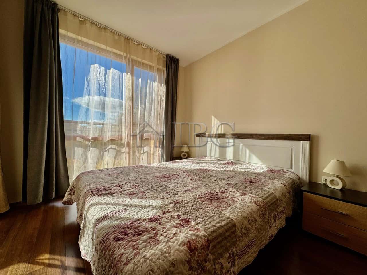 Cozy 1-Bedroom Apartment with Pool View Bright bedroom with large window overlooking the pool in Harmony Suites 1, Sunny Beach.