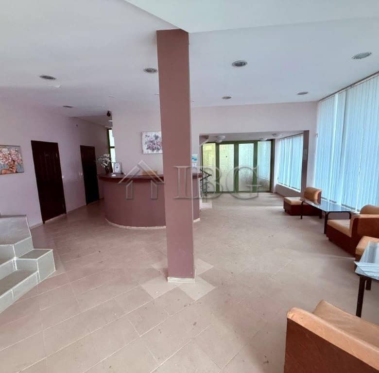 Bright and airy living room with large windows and modern furnishings in Ravda.