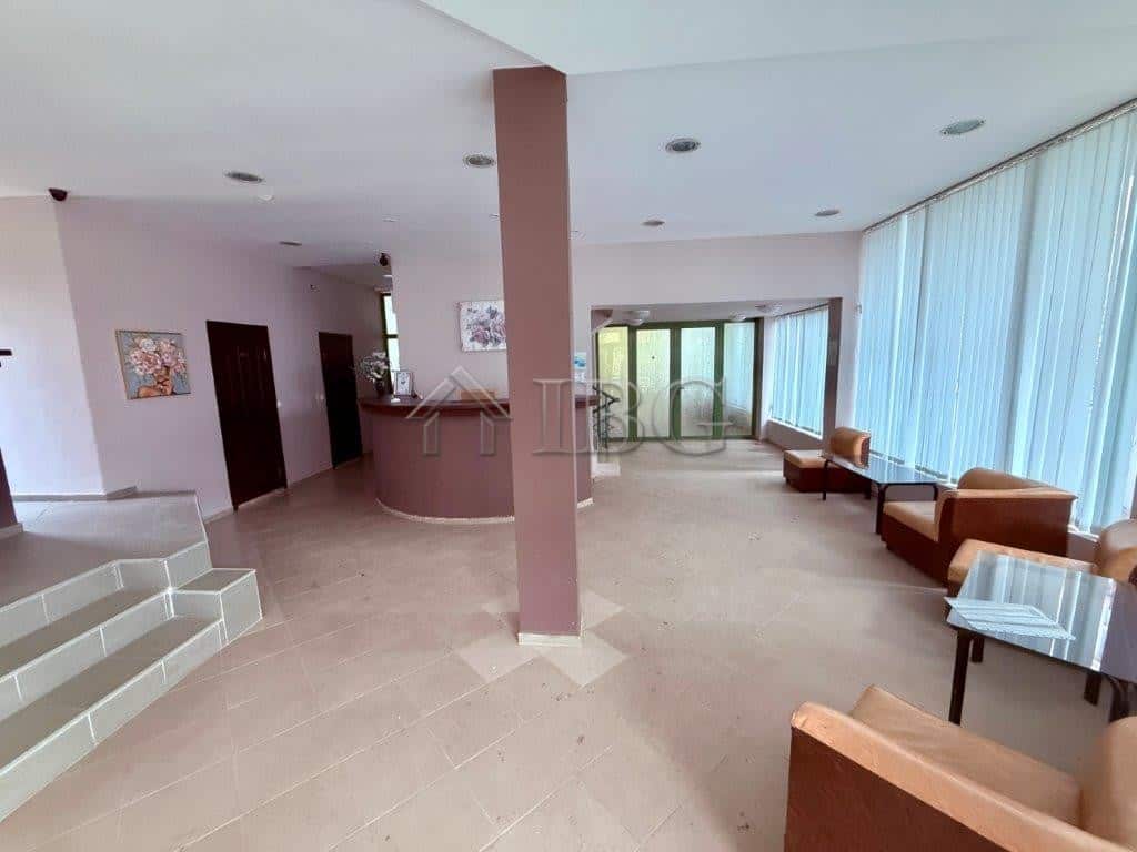 Bright and airy living room with large windows and modern furnishings in Ravda.
