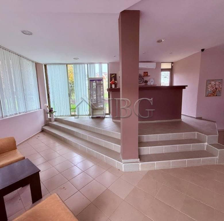 Bright interior of a spacious apartment with large windows and modern decor in Ravda.