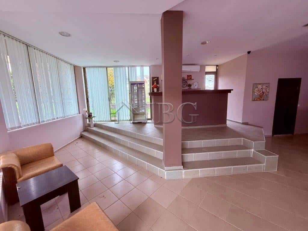 Bright interior of a spacious apartment with large windows and modern decor in Ravda.