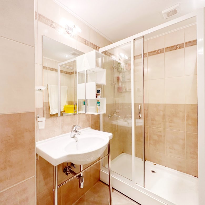 Bathroom with shower enclosure in Peter House Complex, Sunny Beach, Bulgaria.
