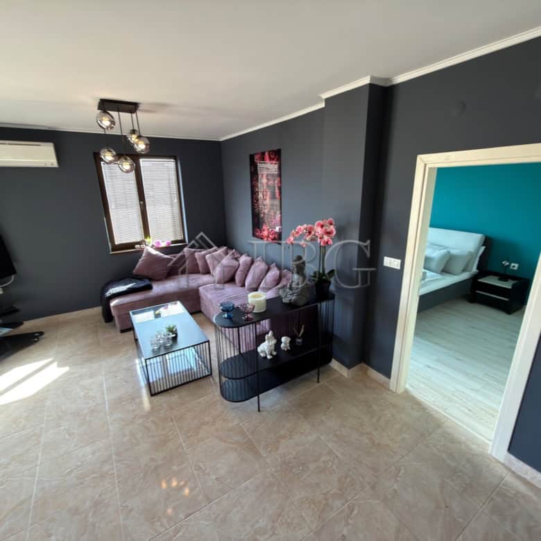 Spacious living area with stylish furniture in a luxury two-bedroom apartment in Nessebar.
