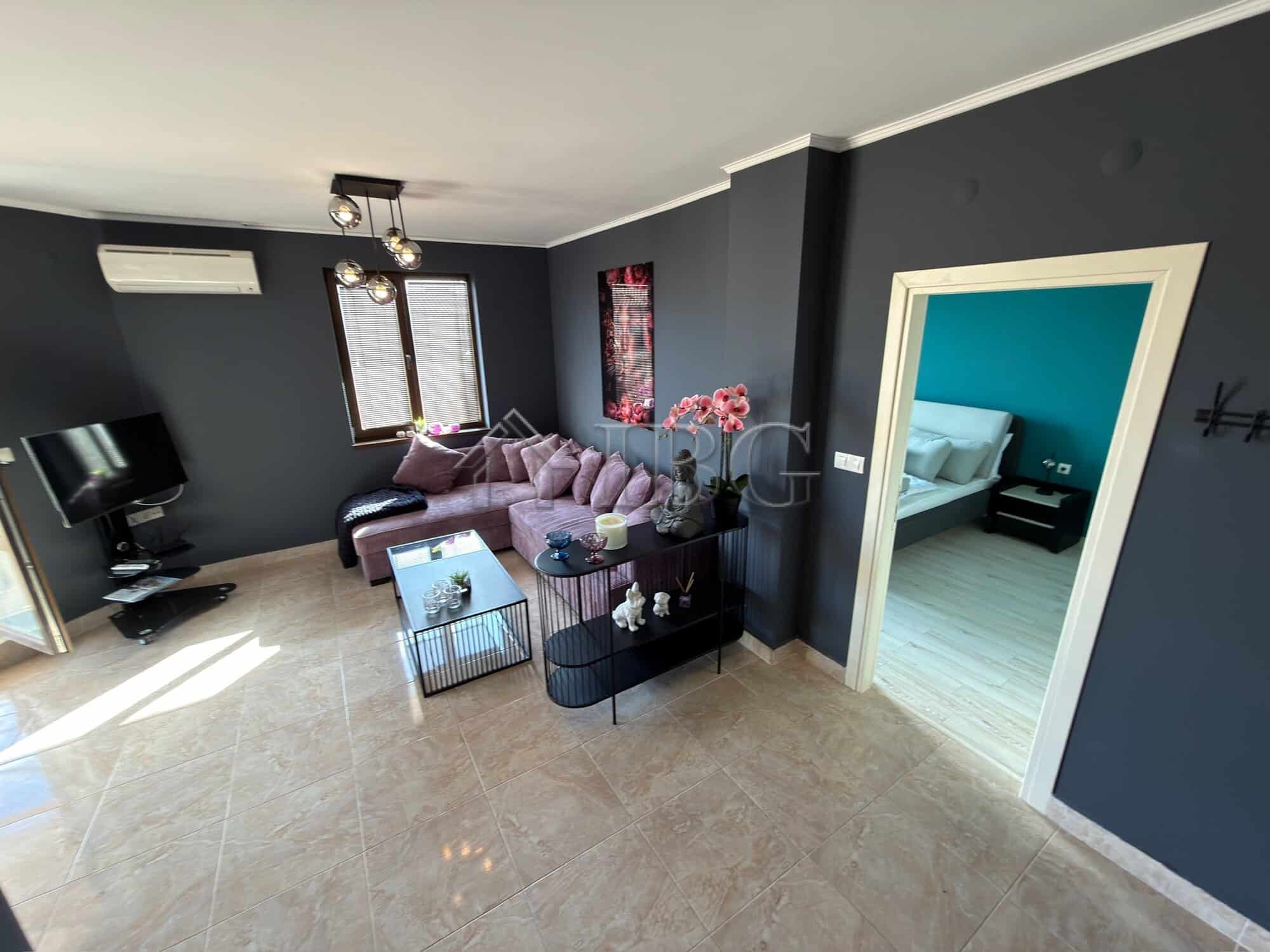 Spacious living area with stylish furniture in a luxury two-bedroom apartment in Nessebar.