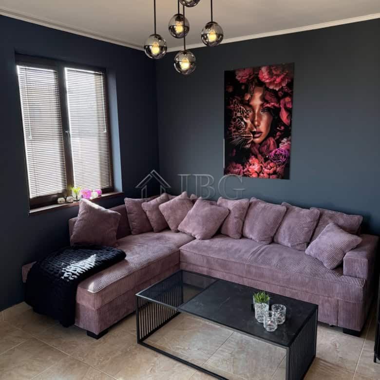Interior of a modern two-bedroom apartment with stylish decor and cozy seating area.