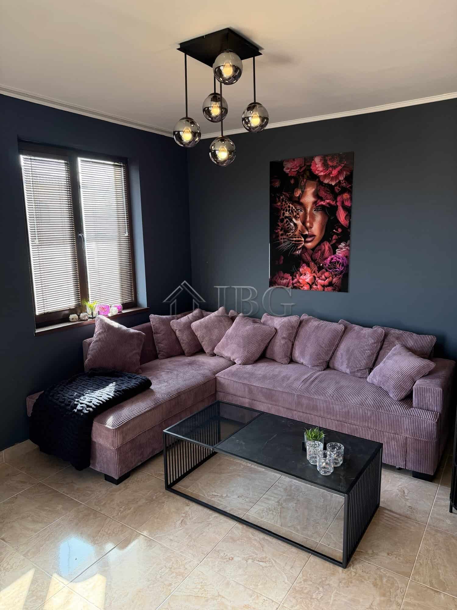 Interior of a modern two-bedroom apartment with stylish decor and cozy seating area.