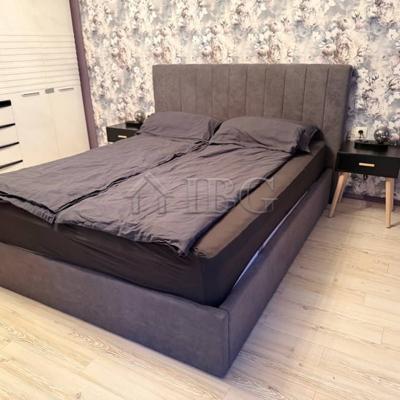 Elegant bedroom with modern decor and comfortable bedding in Nessebar.