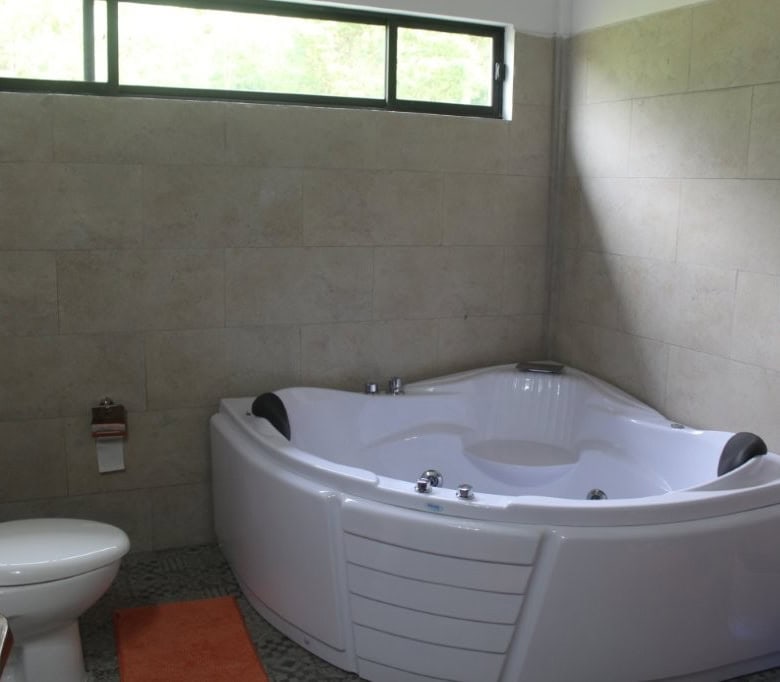 Bathroom with whirlpool tub and modern fixtures in Ecuador property.